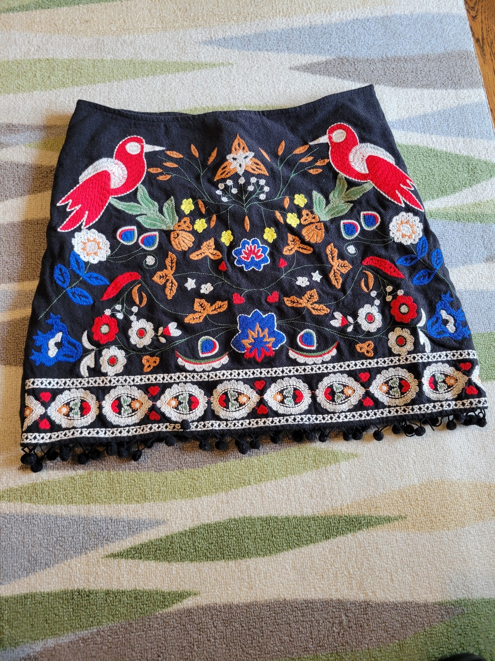 Embroidered Black Mini Skirt with Colorful Floral & Bird Motif